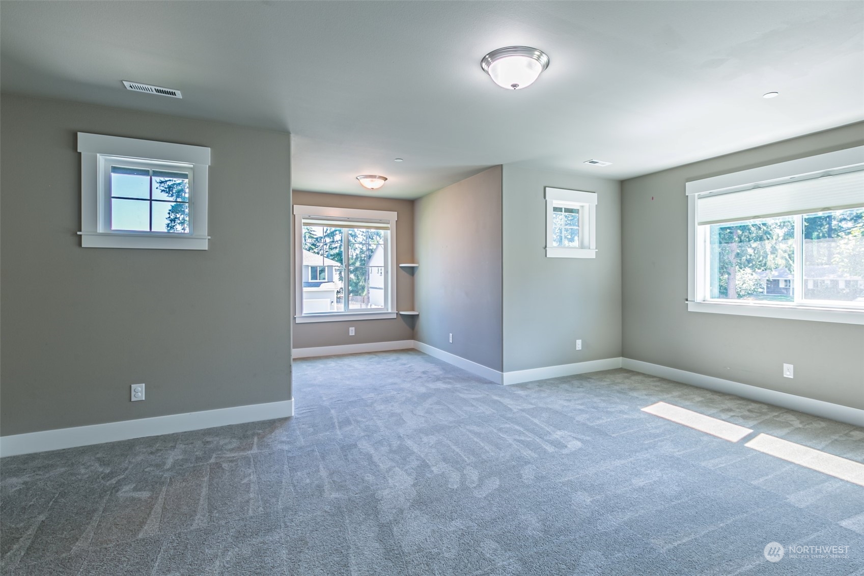 4918 Northeast 1st Street Renton, WA 98059 - Photo 27 of 40 an empty room with windows and closet