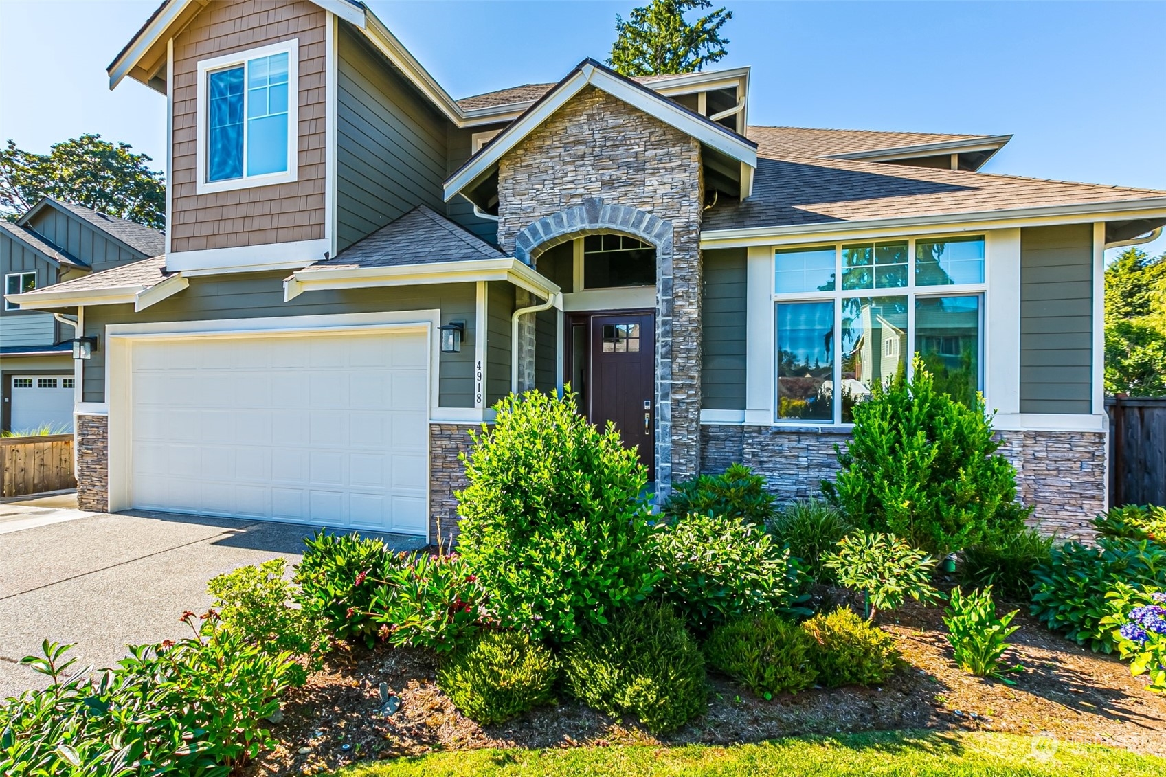 4918 Northeast 1st Street Renton, WA 98059 - Photo 3 of 40 front view of a house with a yard