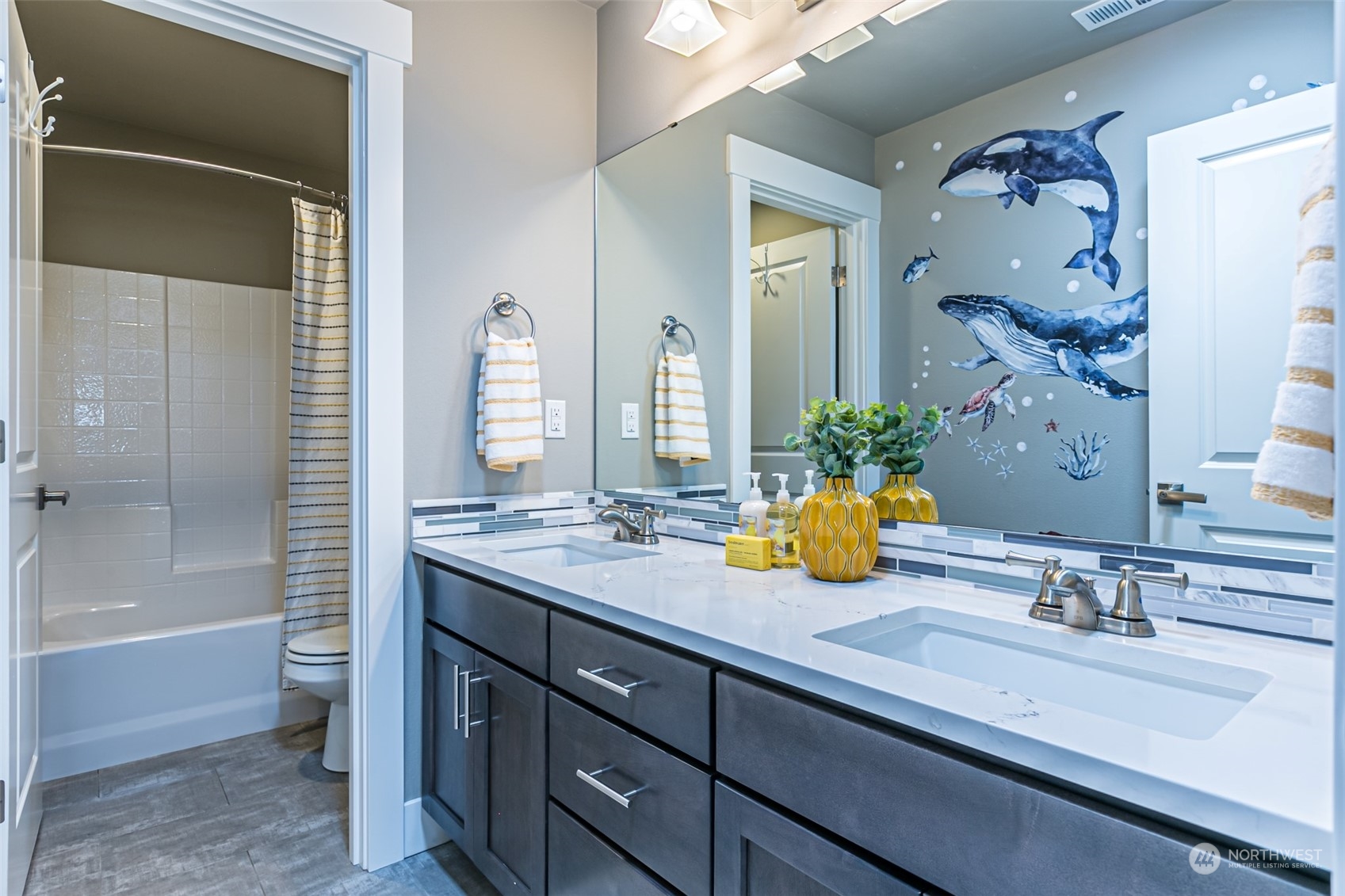4918 Northeast 1st Street Renton, WA 98059 - Photo 31 of 40 a bathroom with a double vanity sink and a mirror