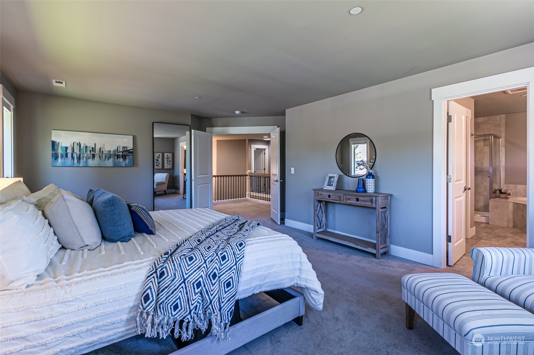 4918 Northeast 1st Street Renton, WA 98059 - Photo 32 of 40 a bedroom with a large bed and a couch