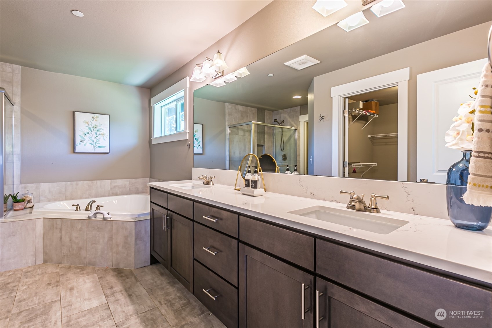 4918 Northeast 1st Street Renton, WA 98059 - Photo 36 of 40 a spacious bathroom with a tub sink and mirror