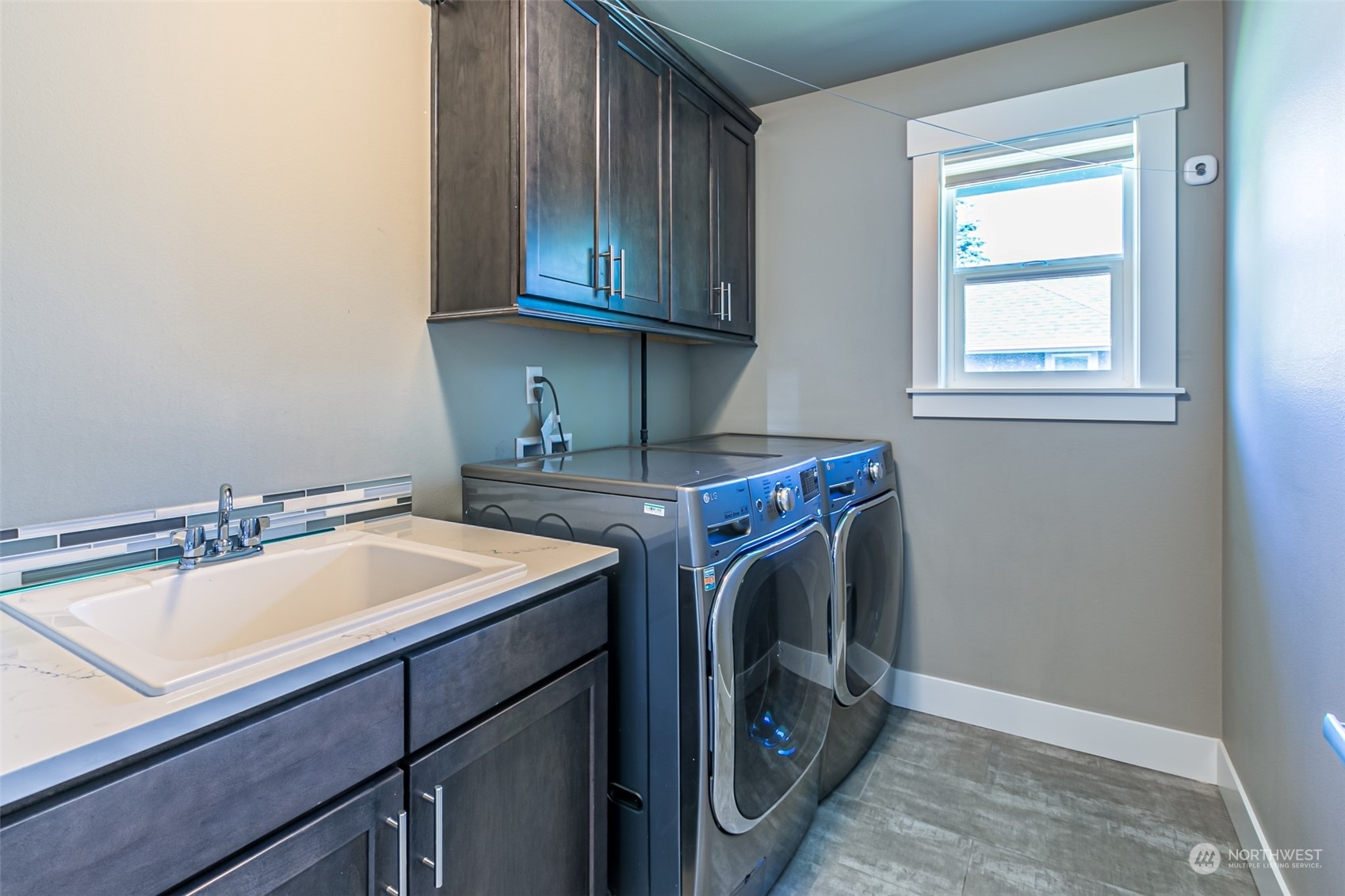 4918 Northeast 1st Street Renton, WA 98059 - Photo 37 of 40 a utility room with faucet washer and dryer