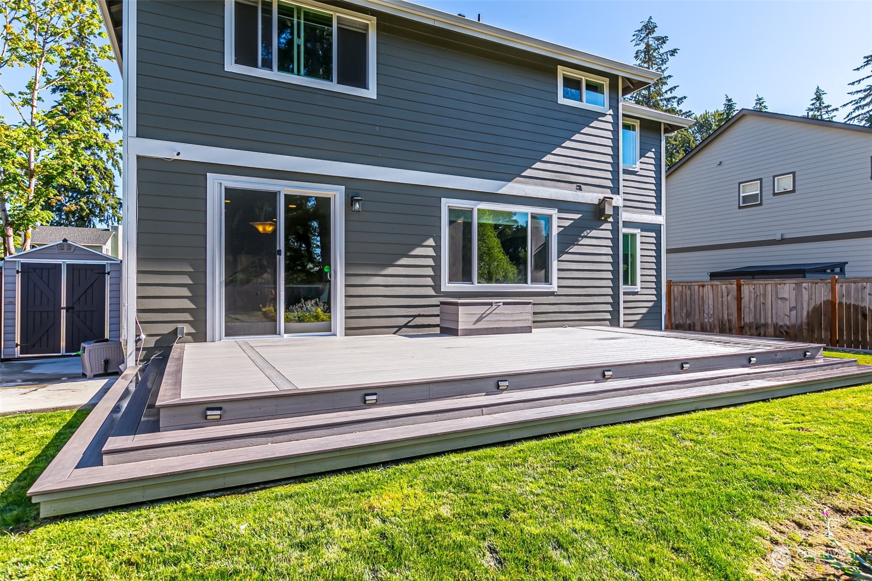 4918 Northeast 1st Street Renton, WA 98059 - Photo 39 of 40 a view of a house with a swimming pool and a yard
