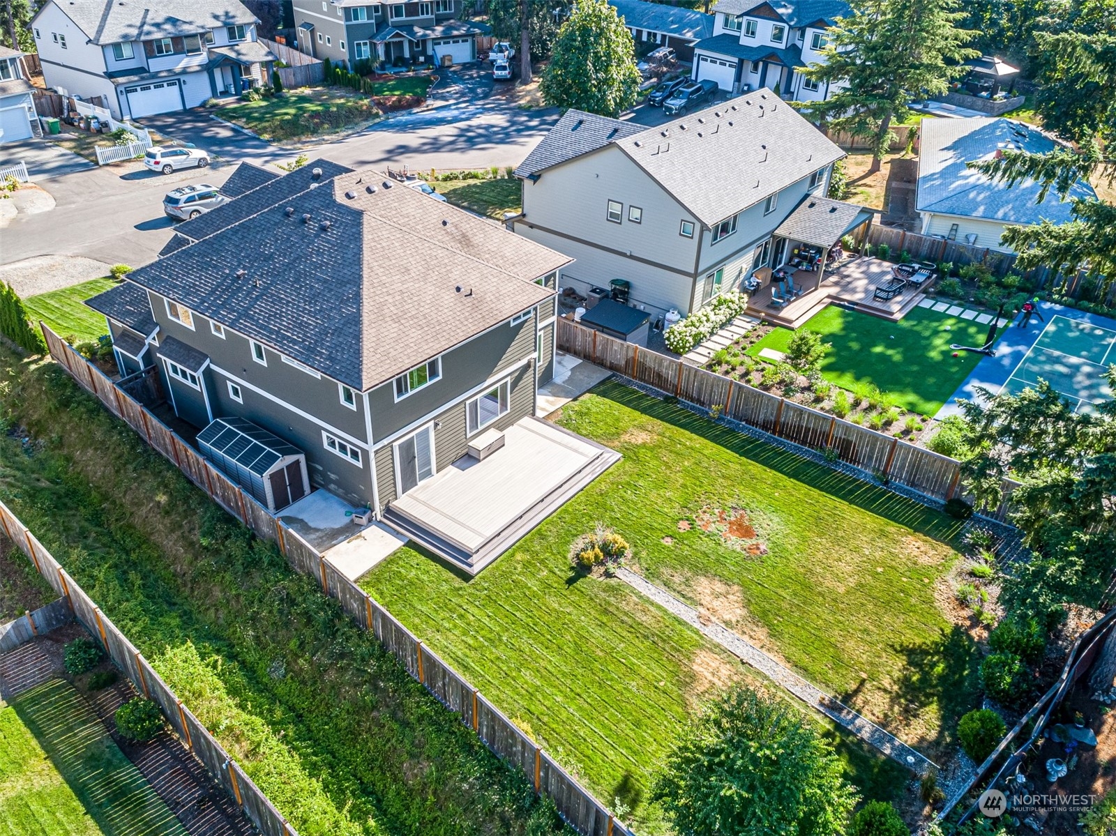 4918 Northeast 1st Street Renton, WA 98059 - Photo 5 of 40 an aerial view of a house with a garden and swimming pool