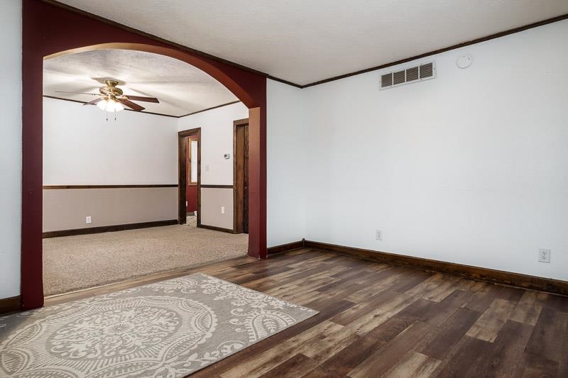 207 River Park Road Loves Park, IL 61111 - Photo 13 of 41 a view of a big room with wooden floor and fan