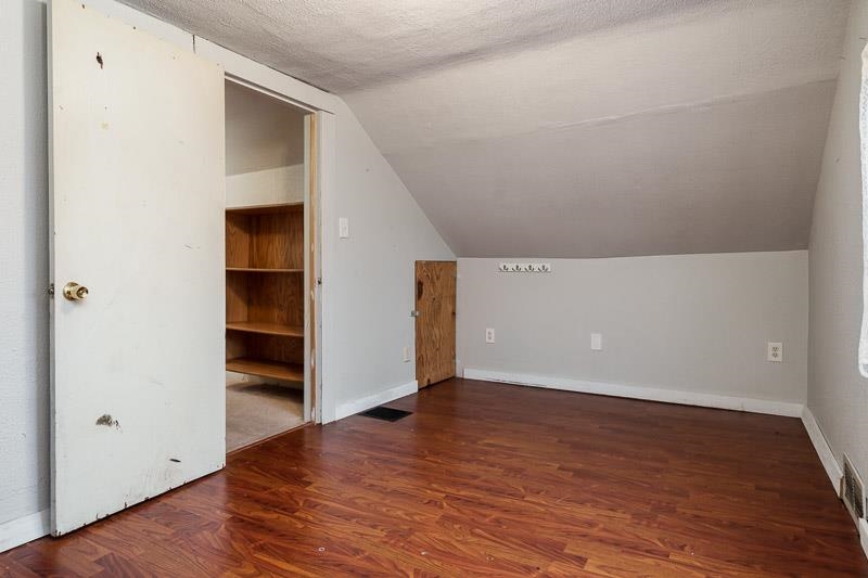 207 River Park Road Loves Park, IL 61111 - Photo 33 of 41 an empty room with wooden floor and closet