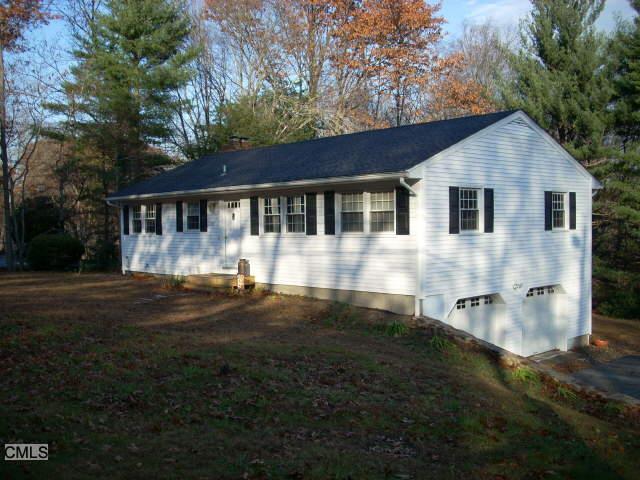 27 Quaker Ridge Road Shelton, CT 06484 - Photo 1 of 1 a front view of a house with a yard