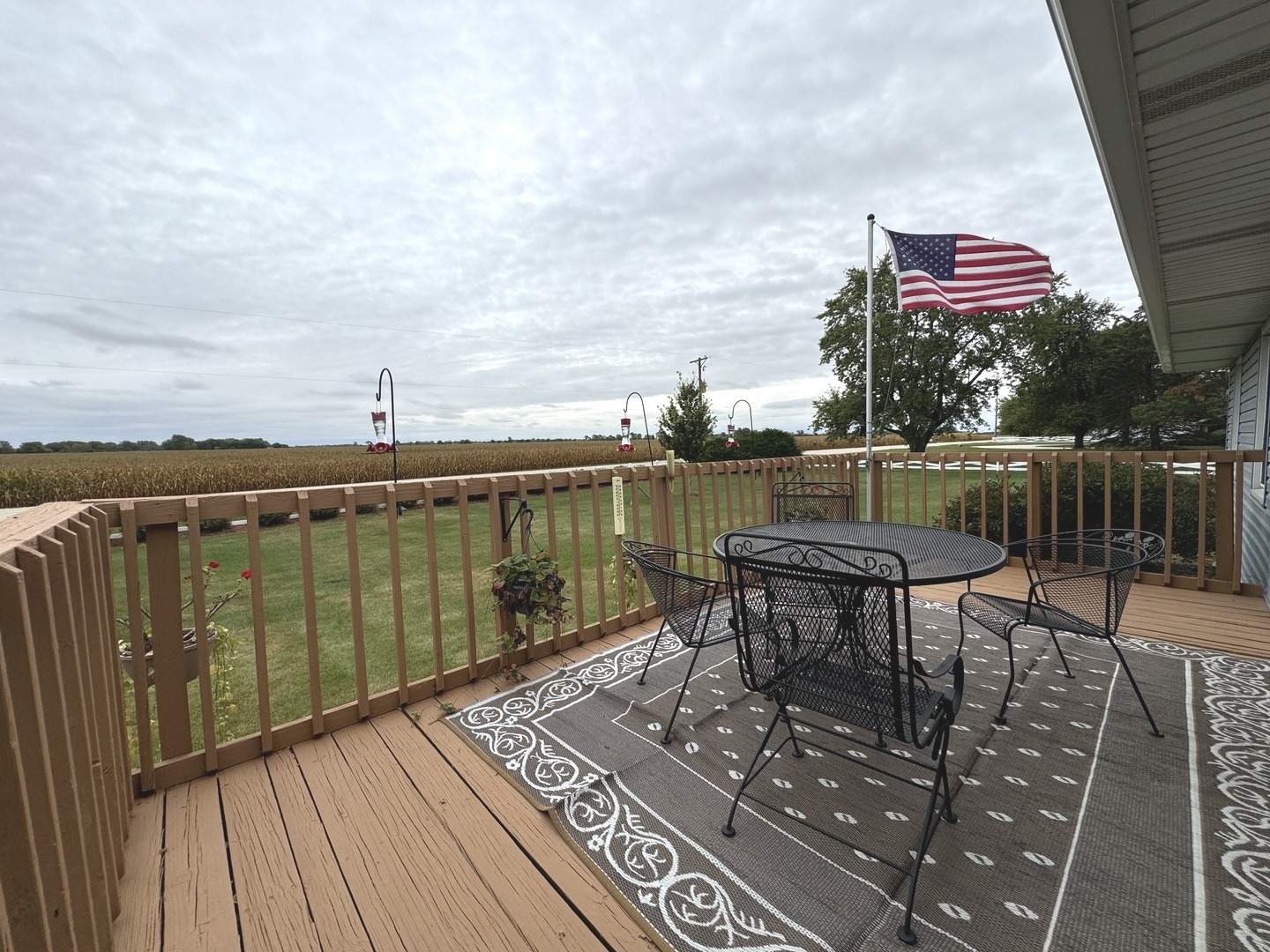 5382 South 2000W Road Chebanse, IL 60922 - Photo 19 of 54 a balcony with wooden floor outdoor seating and city view