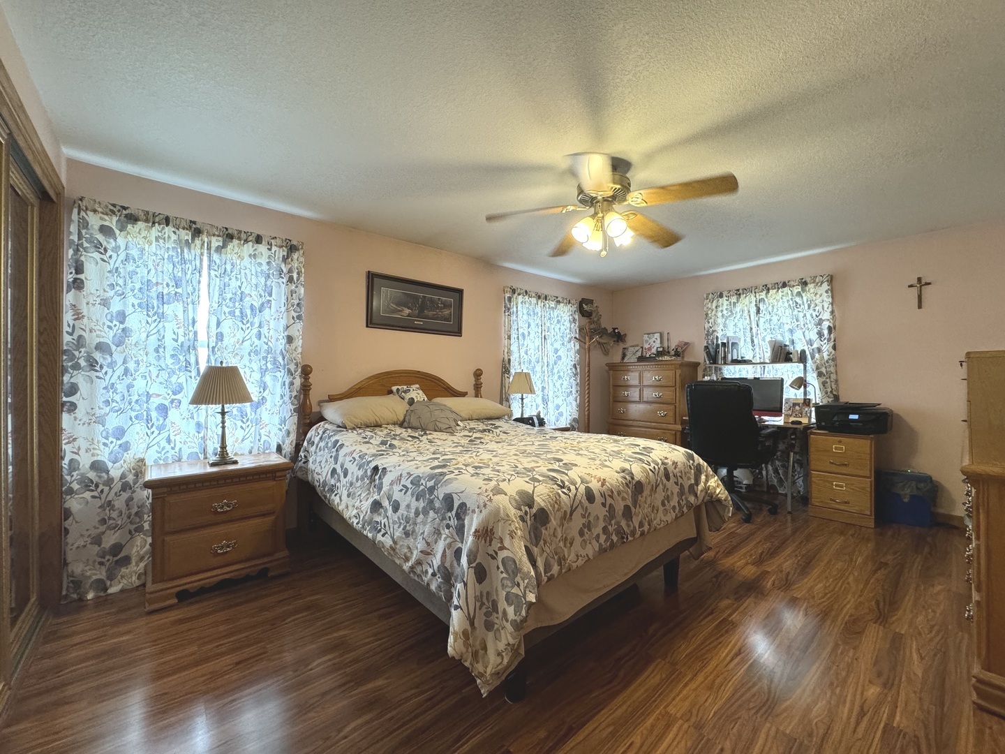 5382 South 2000W Road Chebanse, IL 60922 - Photo 22 of 54 a bedroom with a large bed and a chandelier