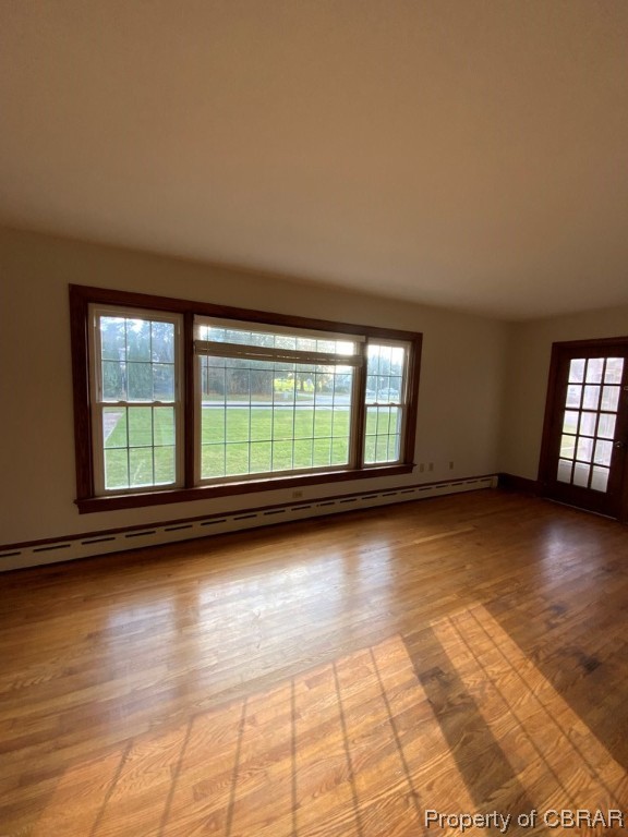 14 Light Street Heathsville, VA 22473 - Photo 7 of 18 Spare room with wood-type flooring and baseboard heating