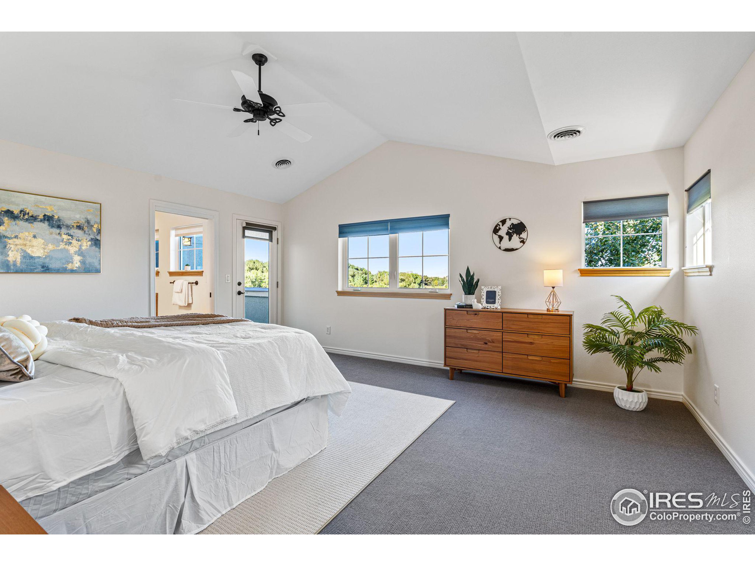 3766 Ridgeway Street Boulder, CO 80301 - Photo 24 of 42 a bedroom with a bed mirror and window