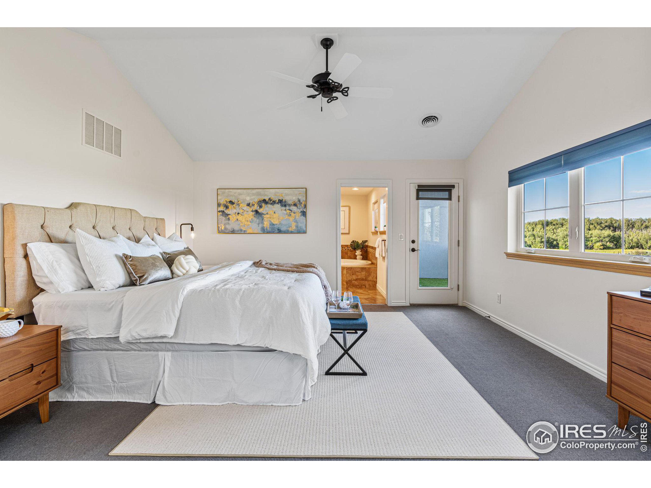 3766 Ridgeway Street Boulder, CO 80301 - Photo 25 of 42 a bed room with a bed and a chandelier