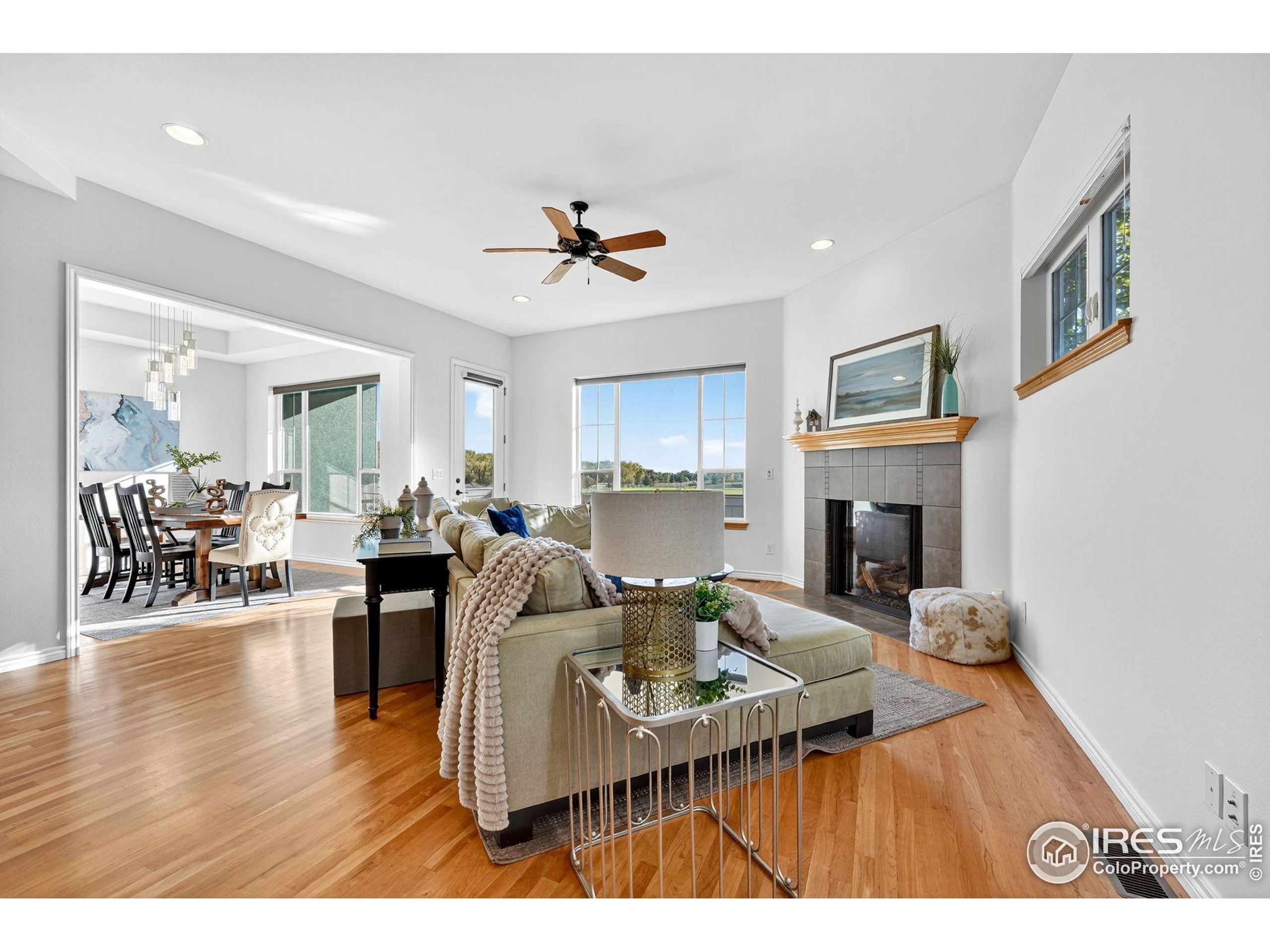 3766 Ridgeway Street Boulder, CO 80301 - Photo 6 of 42 a living room with furniture a fireplace and a flat screen tv
