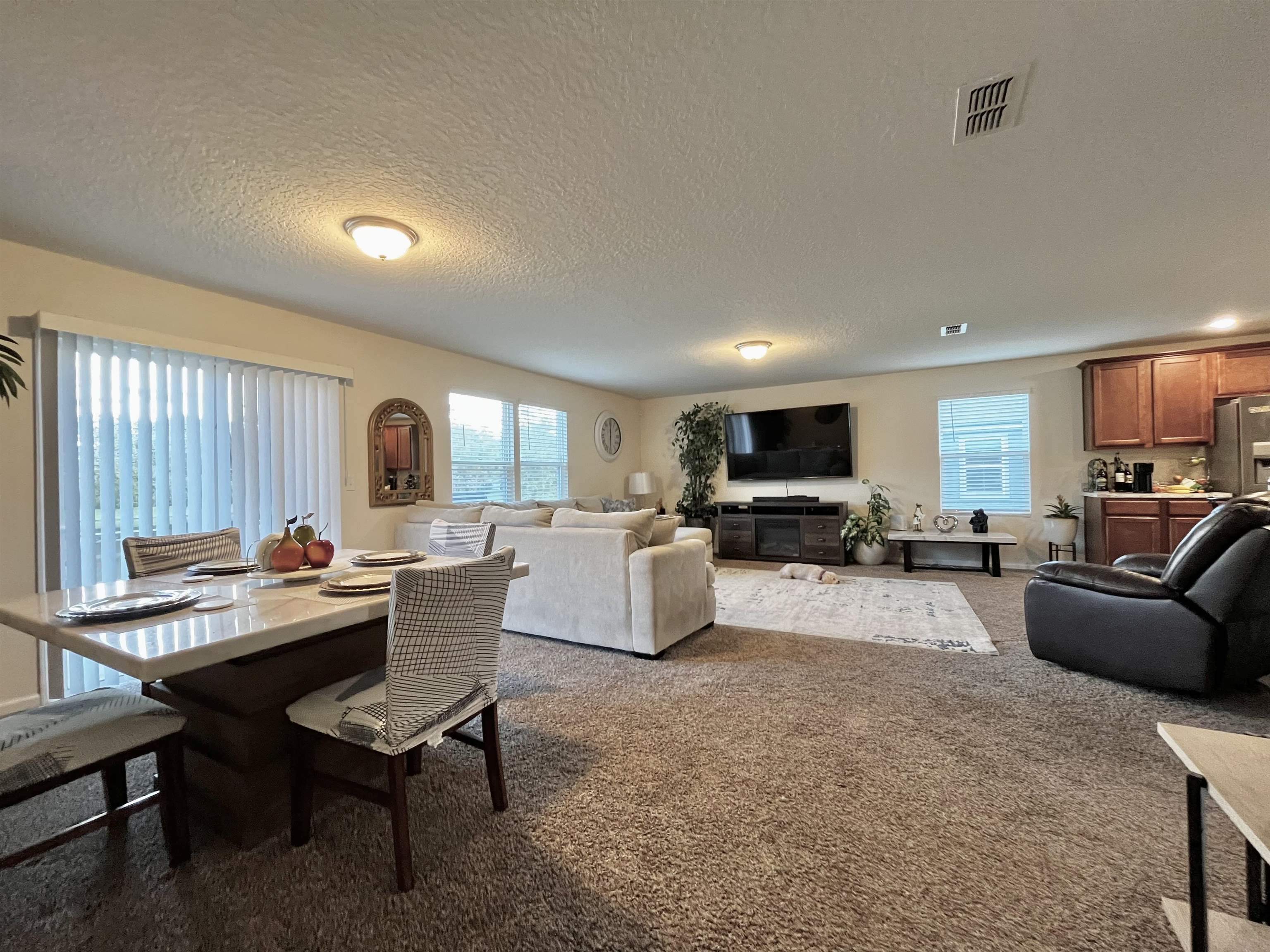 124 Cody Street St. Augustine, FL 32084 - Photo 7 of 8 a living room with furniture and a flat screen tv