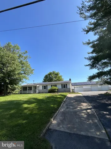 a view of a house with a big yard