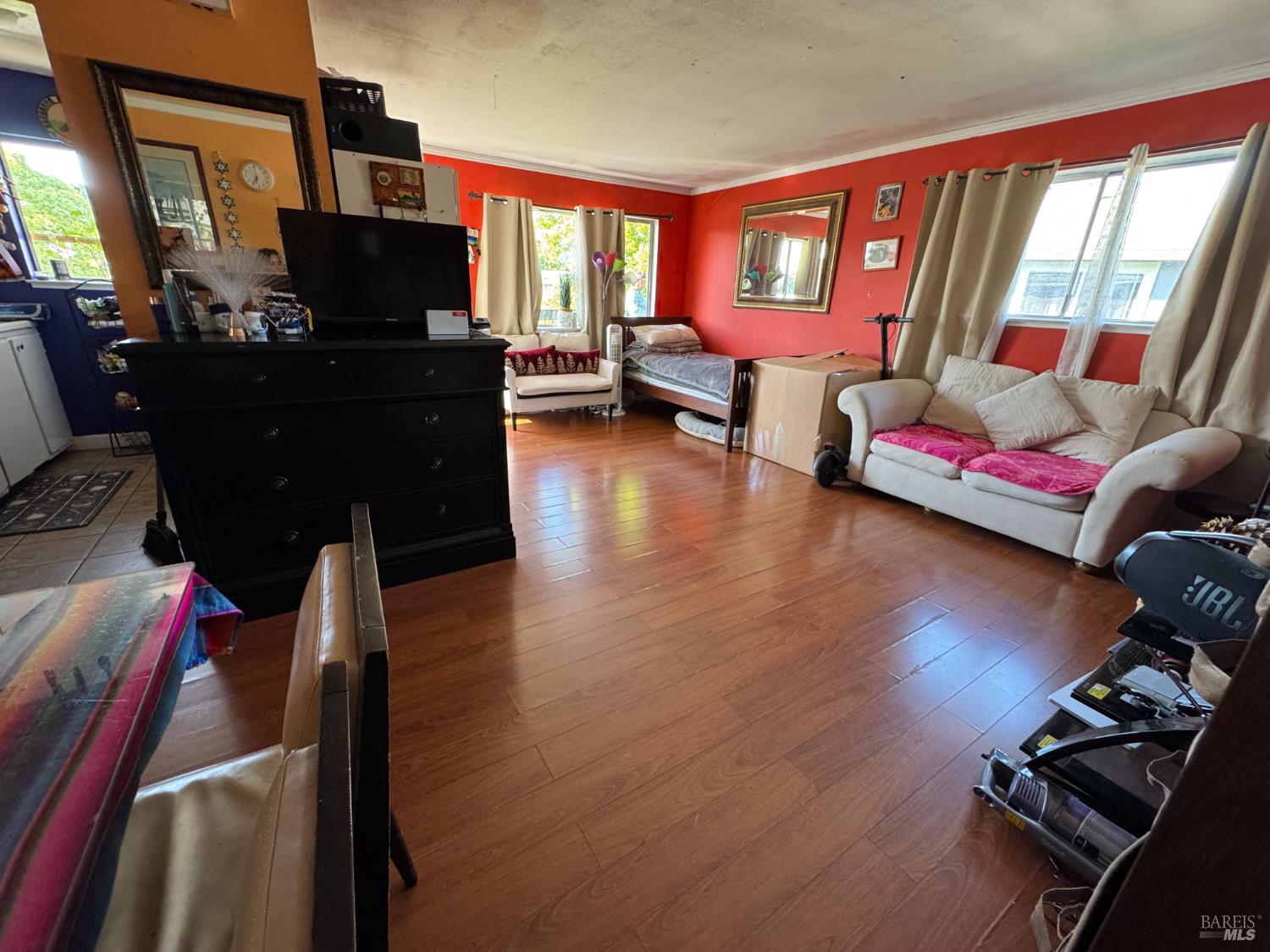 431 Bahia Way San Rafael, CA 94901 - Photo 17 of 46 a living room with furniture and a flat screen tv with wooden floor
