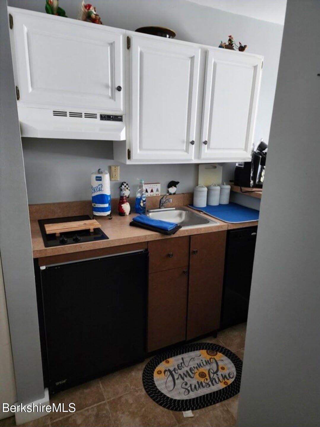 37 Corey Road, Unit 521 Hancock, MA 01237 - Photo 8 of 18 a kitchen with a sink a stove and cabinets