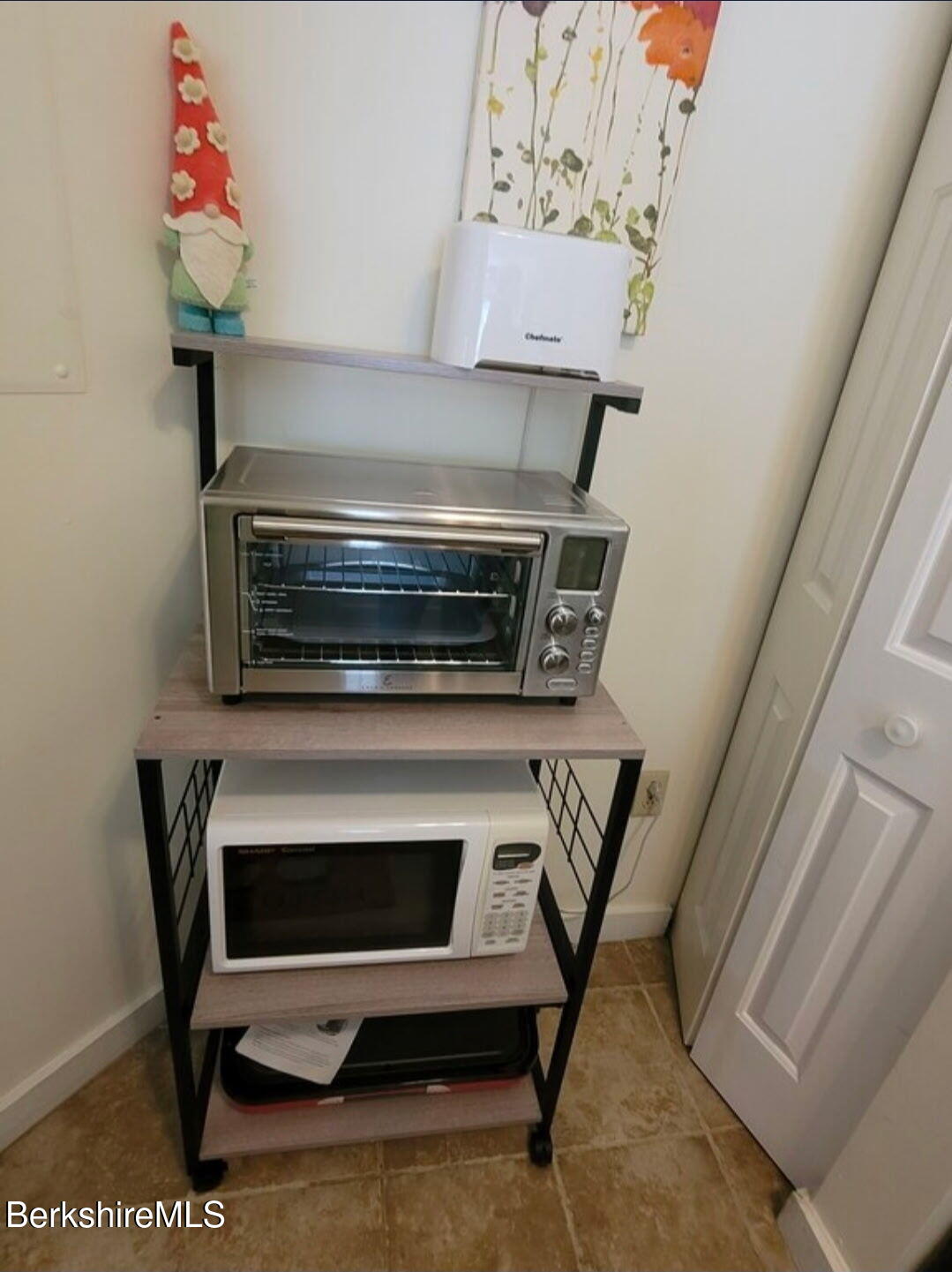 37 Corey Road, Unit 521 Hancock, MA 01237 - Photo 9 of 18 a stove top oven sitting inside of a kitchen