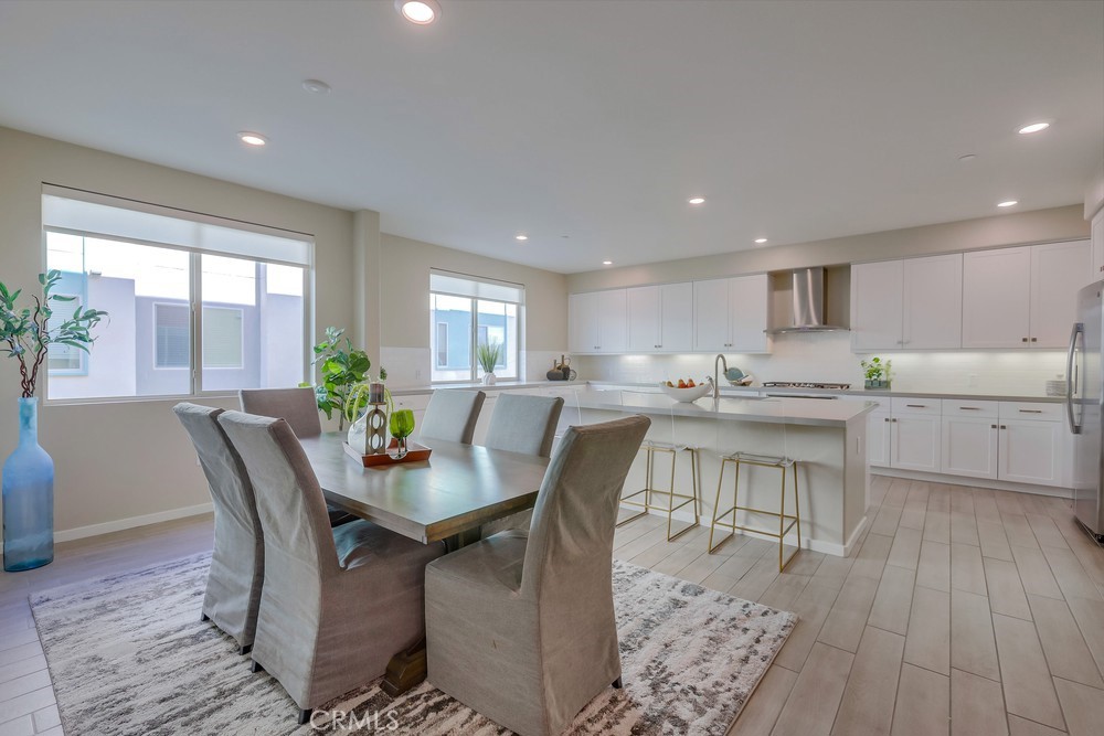 136 Tribeca Irvine, CA 92612 - Photo 1 of 70 a view of a dining room with furniture and wooden floor