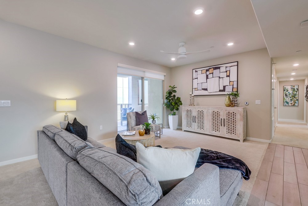 136 Tribeca Irvine, CA 92612 - Photo 12 of 70 a living room with furniture and wooden floor