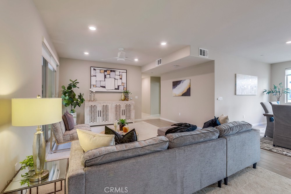 136 Tribeca Irvine, CA 92612 - Photo 13 of 70 a living room with furniture and a lamp