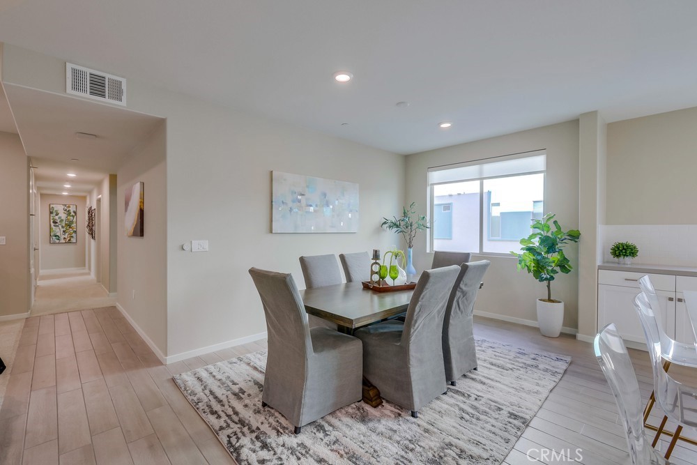 136 Tribeca Irvine, CA 92612 - Photo 17 of 70 a view of a dining room with furniture
