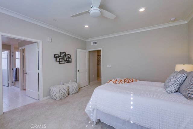 a bathroom with a double vanity sink mirror and shower