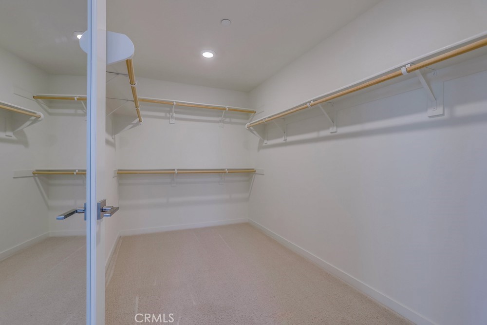 136 Tribeca Irvine, CA 92612 - Photo 30 of 70 a view of walk in closet with empty racks
