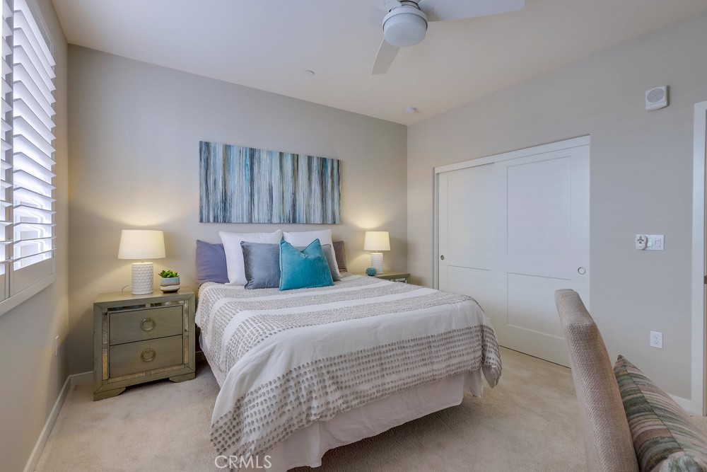 136 Tribeca Irvine, CA 92612 - Photo 33 of 70 a bedroom with a bed and a night stand