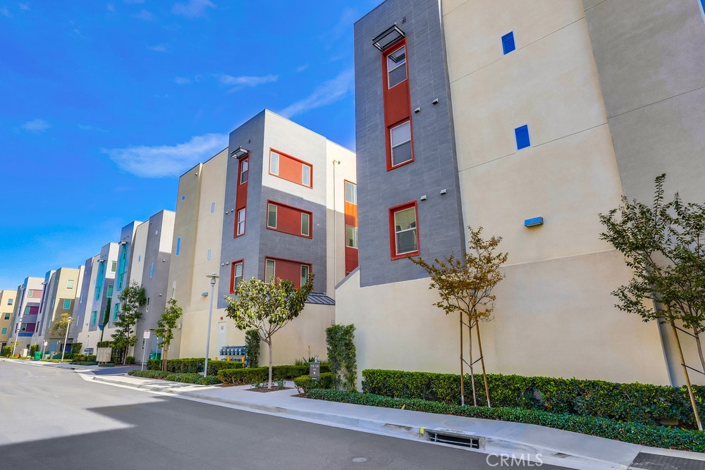 136 Tribeca Irvine, CA 92612 - Photo 53 of 70 a front view of a building with tree s