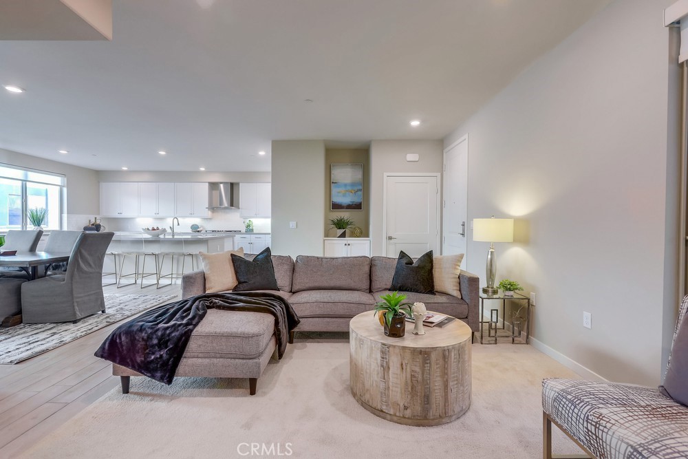 136 Tribeca Irvine, CA 92612 - Photo 9 of 70 a living room with furniture and a table