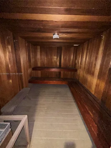 a view of room with stairs and wooden floor