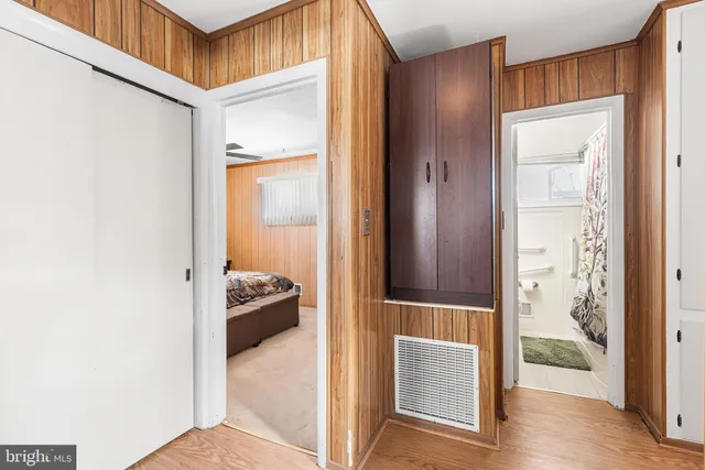 a view of hallway with livingroom and furniture