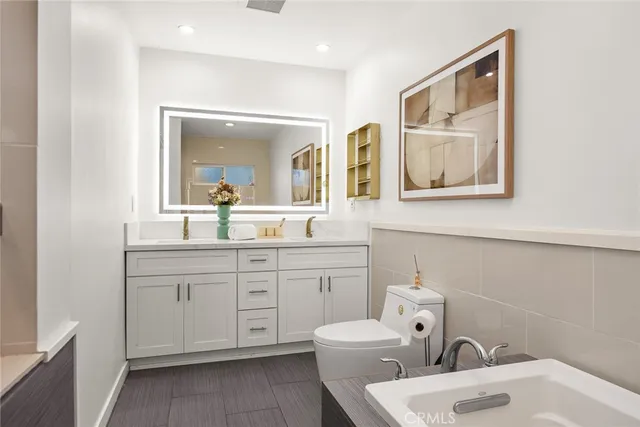 a kitchen with a stove a sink and a refrigerator