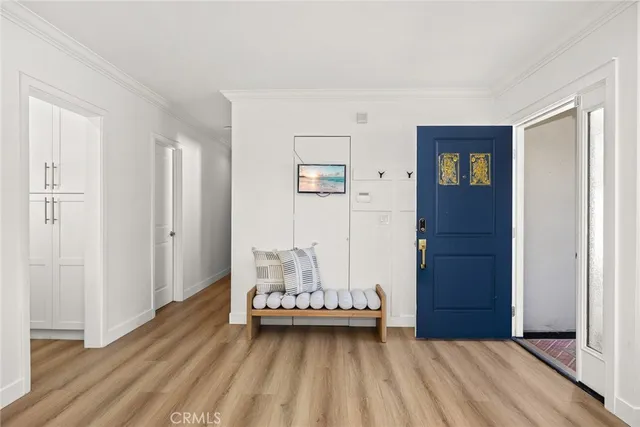 a view of a room with wooden floor