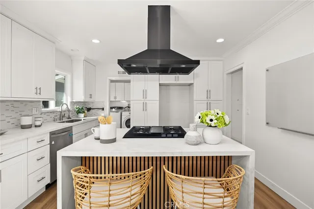 a kitchen with a table chairs and stove