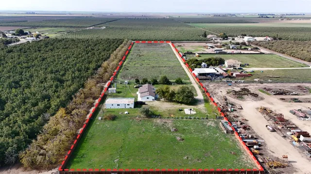 a large kitchen with a table and chairs
