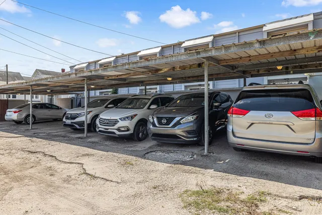 a view of parking garage with cars