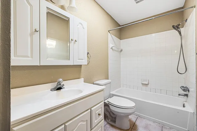 a bathroom with a sink a toilet and a bathtub