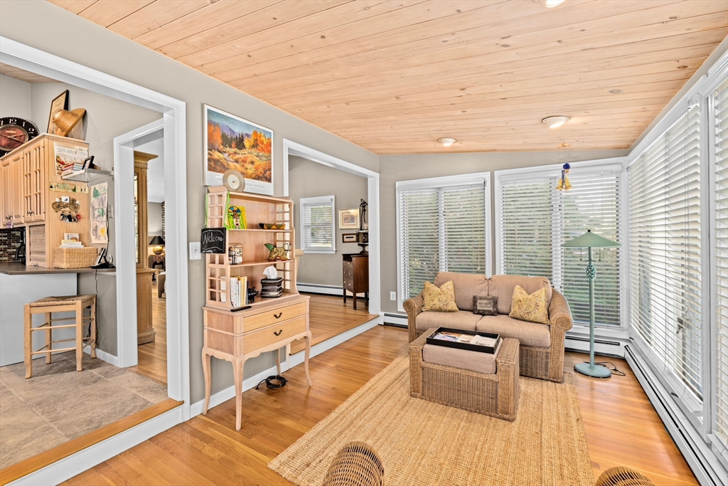 14 Aberdeen Drive Scituate, MA 02066 - Photo 12 of 42 a living room with furniture large windows wooden floor and furniture