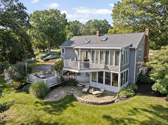 a spacious bedroom with a bed and dresser