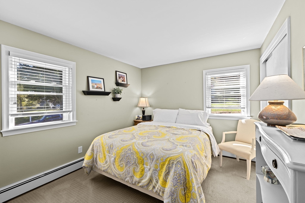 14 Aberdeen Drive Scituate, MA 02066 - Photo 20 of 42 a bedroom with a bed and wooden floor