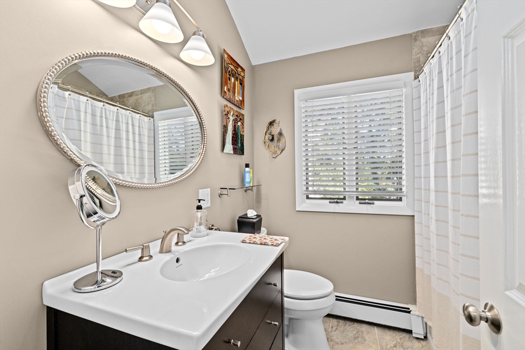 14 Aberdeen Drive Scituate, MA 02066 - Photo 22 of 42 a bathroom with a sink a mirror and a toilet