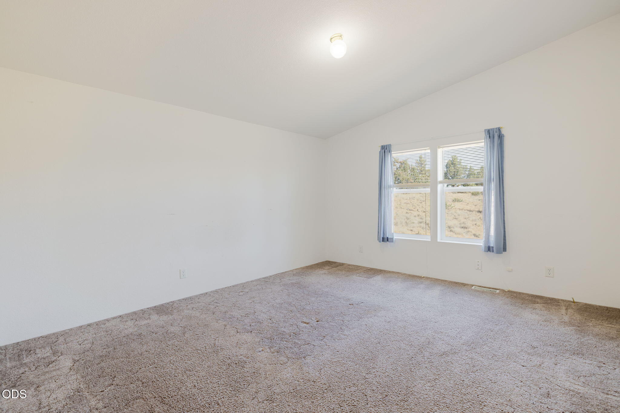 8628 Southwest Crater Loop Road Terrebonne, OR 97760 - Photo 24 of 36 an empty room with windows