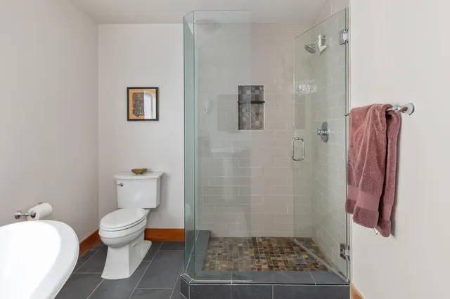a view of storage and utility room with two washing machine