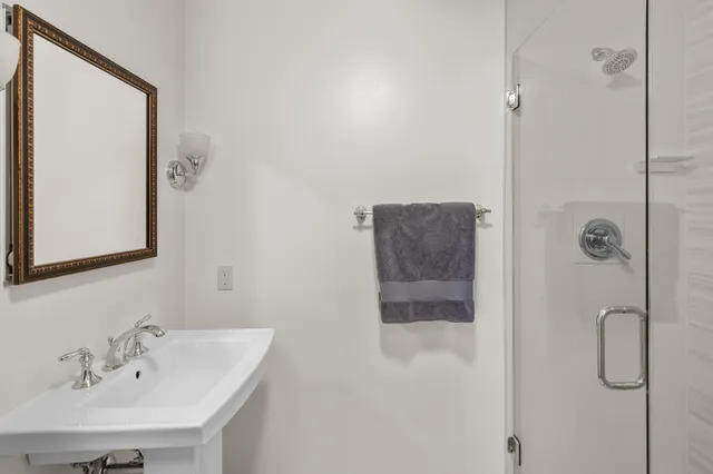 a view of a large house with a big yard and large trees