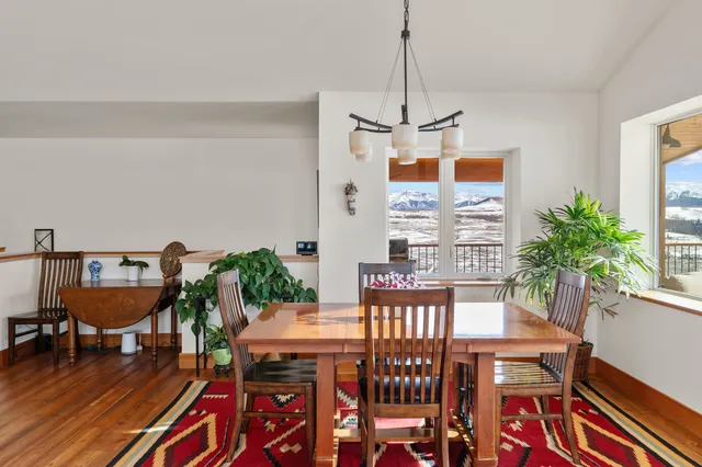 a view of a dining room with furniture window and outside view