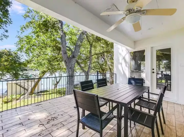 a view of a patio with a table and chairs