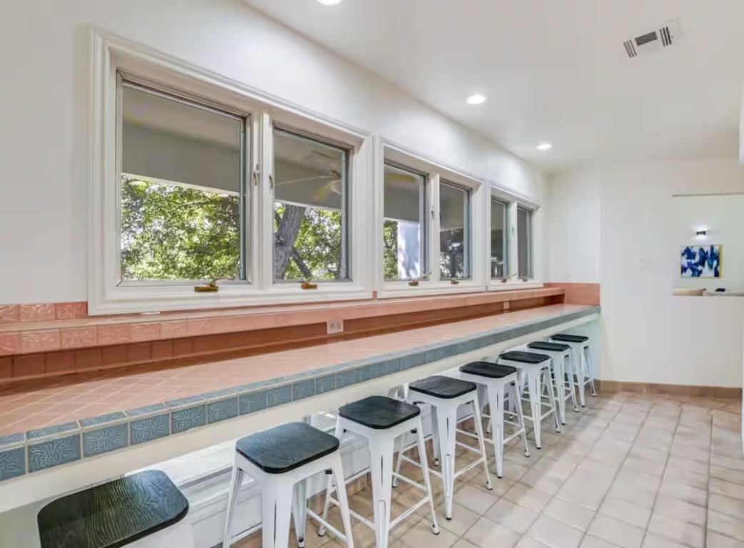 1263 Terminal Loop Road McQueeney, TX 78123 - Photo 16 of 33 a dining room with furniture and a floor to ceiling window