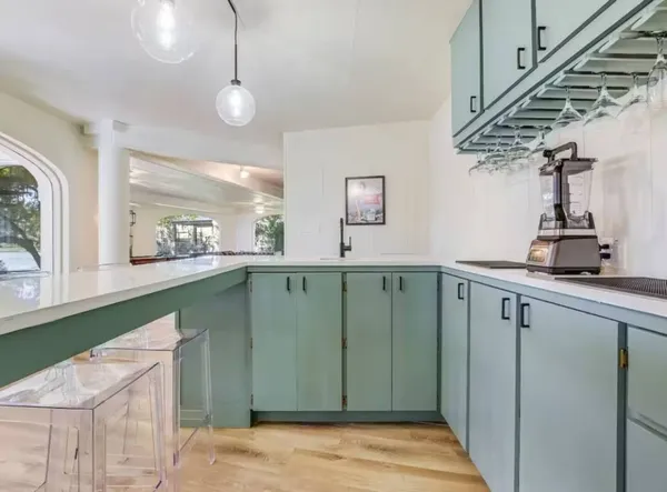 a view of a kitchen from the hallway